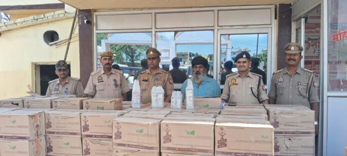 अलीनगर पुलिस ने बरामद शराब एवं पकड़ा गया तस्कर।